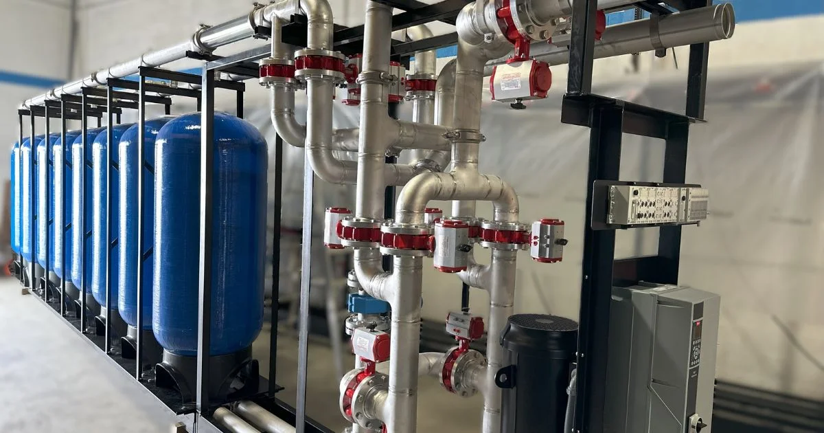 Industrial water filtration system with tanks and piping