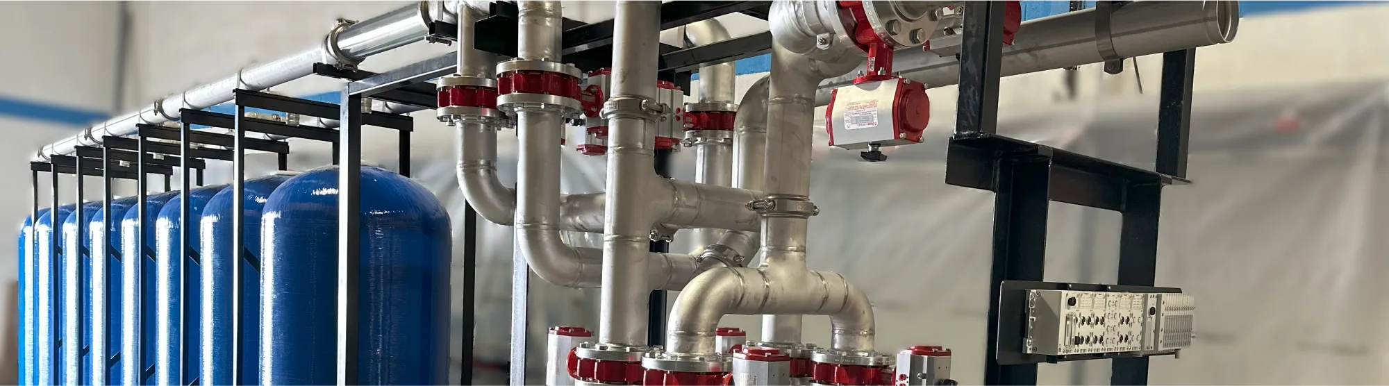 Filtration tanks and piping inside a containerized water treatment system