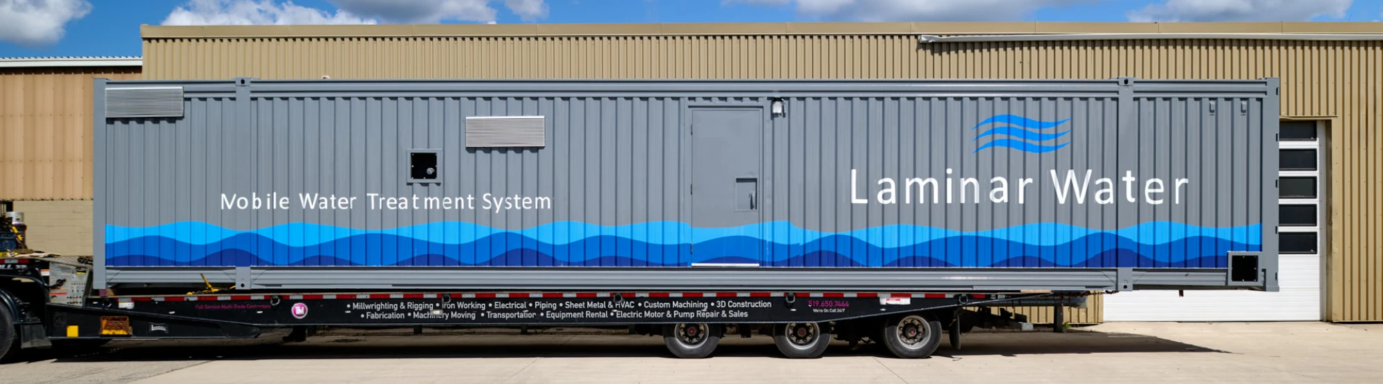 Containerized mobile water treatment system positioned outdoors for deployment
